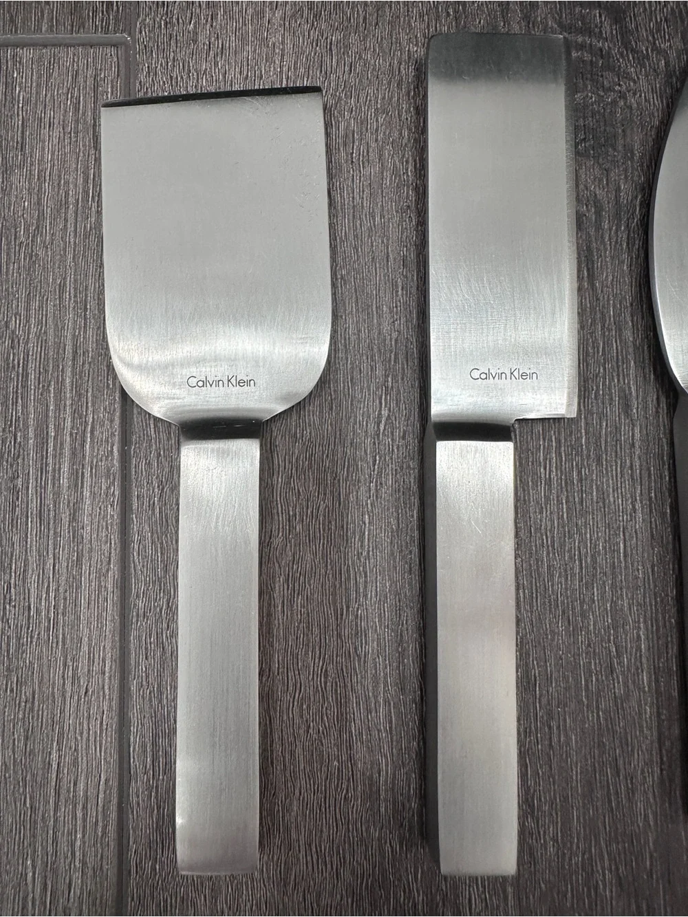 Calvin Klein stainless steel cheese serving set by Calvin Klein Home collection.